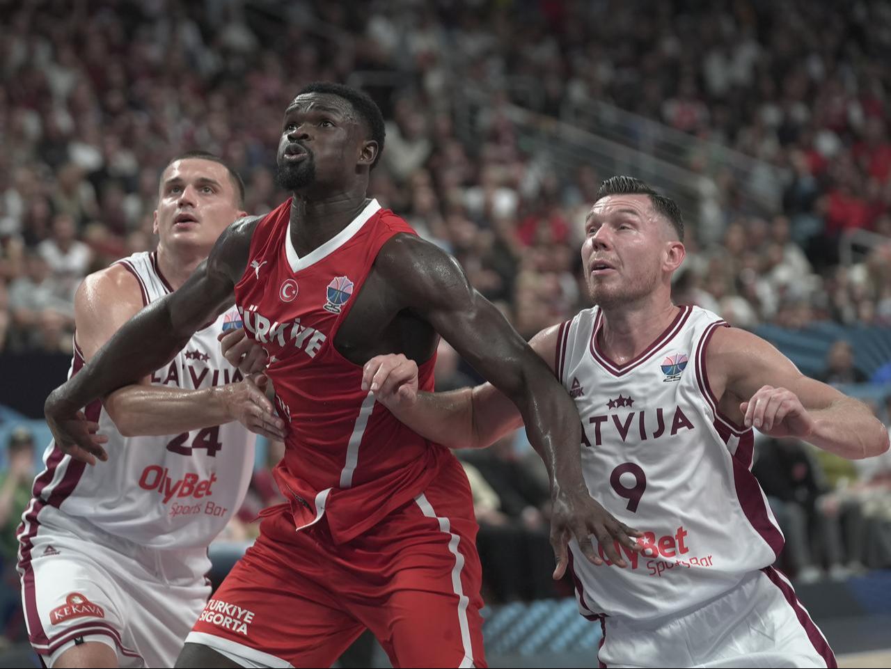 Adem Bona of Türkiye in action against Andrejs Grazulis of Latvia during the FIBA EuroBasket 2025 Group A 1st week match between Latvia and Türkiye, Riga, Latvia, Aug. 27, 2025. (AA Photo)