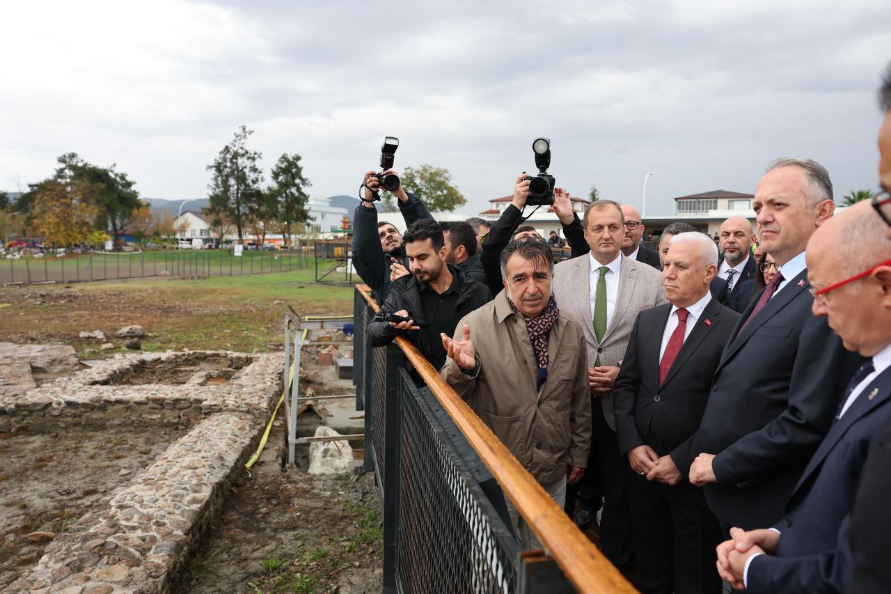 Officials and guests visit the Iznik Lake Basilica archaeological site following the inauguration of the new visitor welcome center in Bursa, Türkiye, Oct. 28, 2025. (IHA Photo)