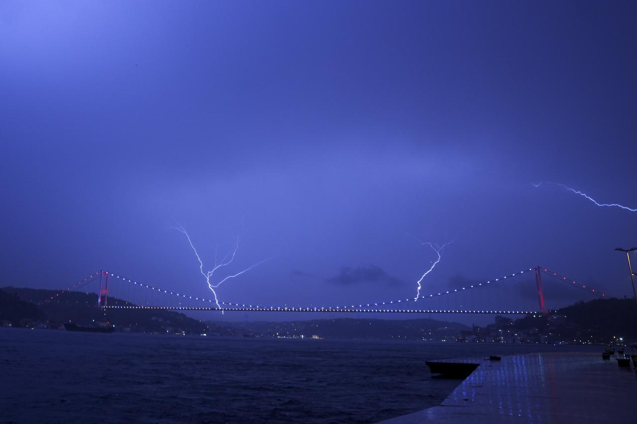 Lightning illuminates the sky above the 15th July Martyrs' Bridge during a thunderstorm in Istanbul, Türkiye, Oct. 27, 2025. (AA Photo)