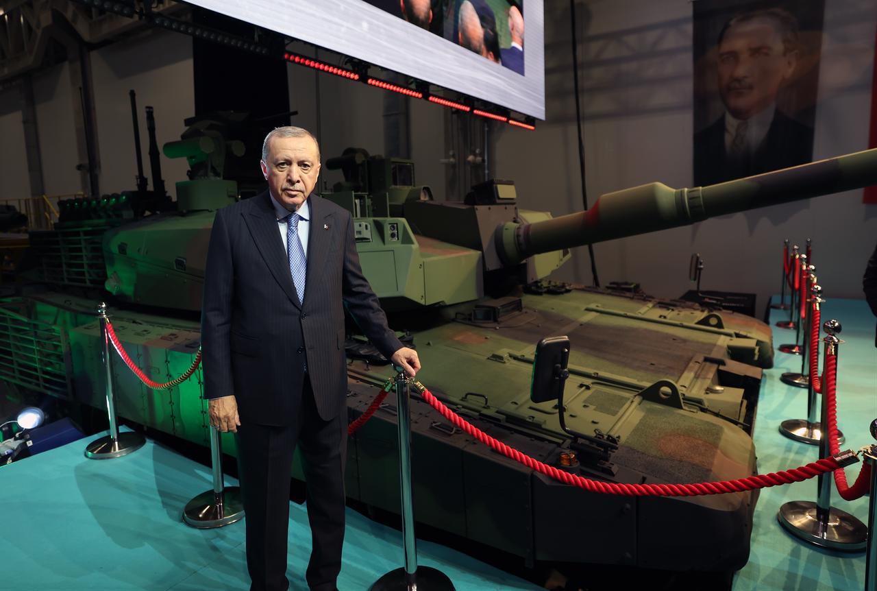 President Recep Tayyip Erdogan poses with the Altay main battle tank during an event in Kahramankazan, Ankara, October 28, 2025. (Photo via Turkish Presidency/Murat Cetinmuhurdar)