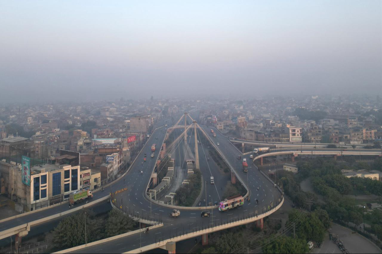 An aerial view shows the city skyline engulfed in smog in Lahore on October 25, 2025. (AFP Photo)