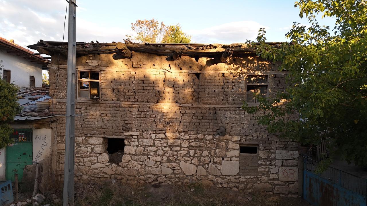 The abandoned two-story house in Yarisli village, built in the 1950s using stones inscribed with Emperor Caracalla’s letter, Burdur, Türkiye, Oct. 28, 2025. (IHA Photo)