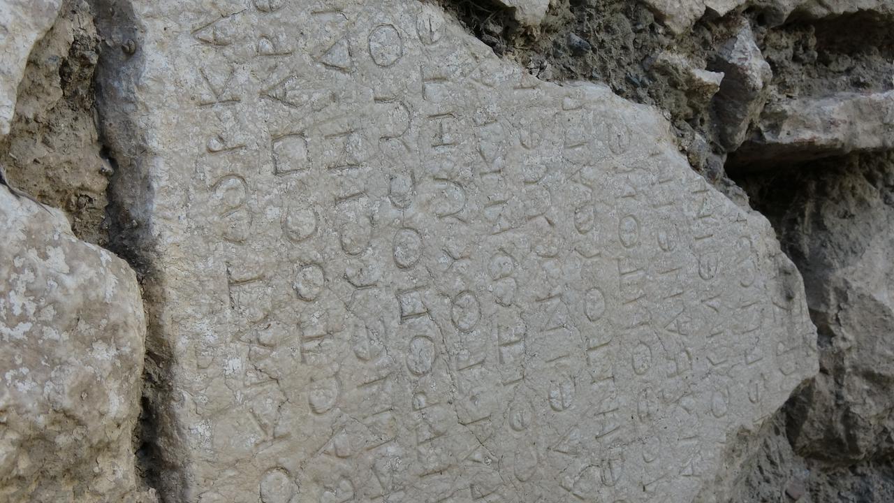 Detailed view of the ancient inscription embedded in the wall—part of the imperial letter attributed to Roman Emperor Caracalla, Burdur, Türkiye, Oct. 28, 2025. (IHA Photo)