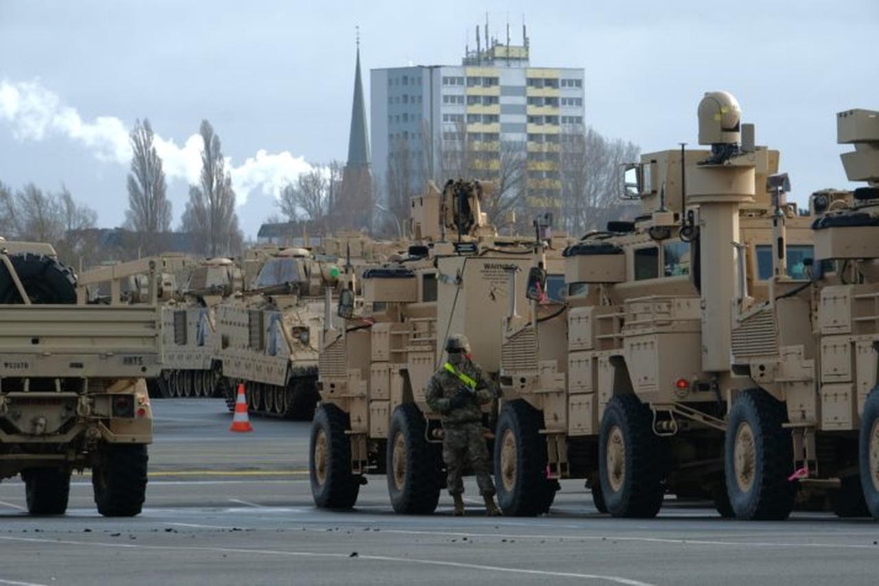 Military personnel unload Bradley Infantry Fighting tanks of the 2nd Brigade Combat Team, 3rd Infantry Division, as US military equipment arrives at the Port of Bremerhaven, Germany, Feb. 21, 2020. (AFP Photo)