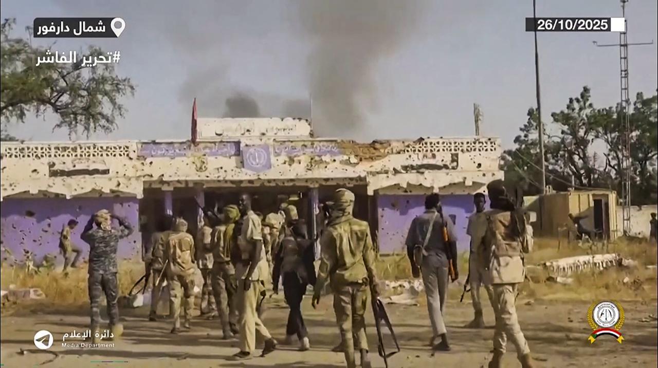 This image grab taken from handout video footage released on Sudans paramilitary Rapid Support Forces (RSF) Telegram account on October 26, 2025, shows RSF fighters holding weapons and celebrating in the streets of El-Fasher in Sudans Darfur, on Oct. 27, 2025. (AFP Photo )