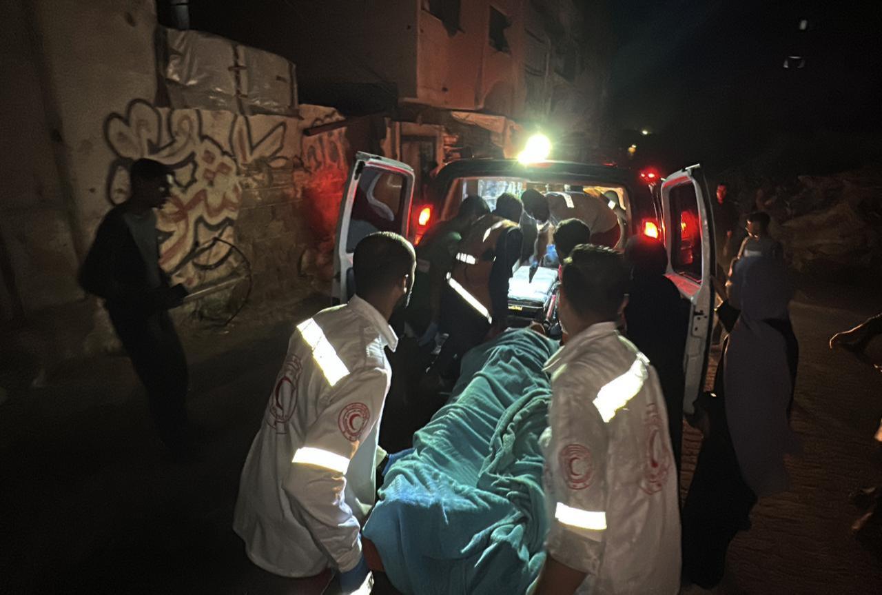Injured Palestinians are taken to an ambulance for medical treatment following the Israeli attack on a house in Sabra neighborhood in Gaza City, Gaza, October 28, 2025. (AA Photo)