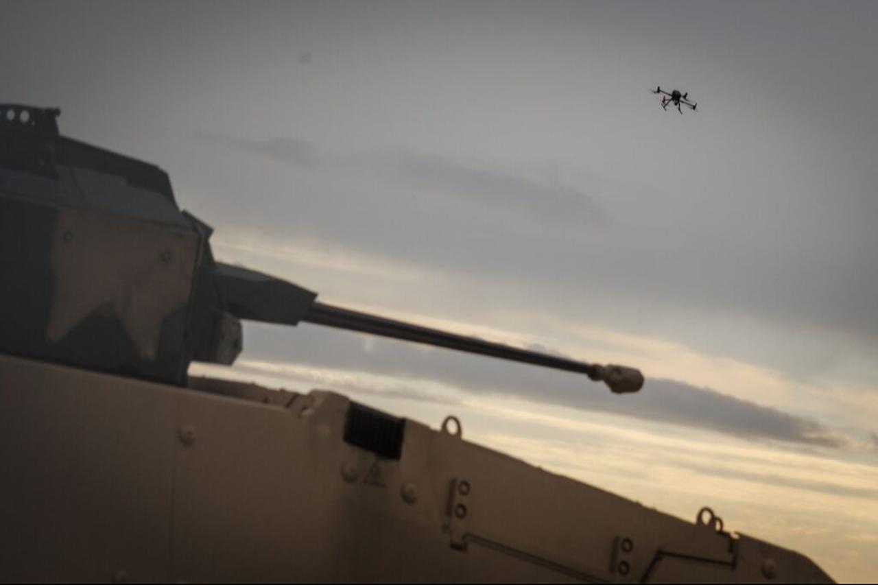 A drone flies above a vehicle Lav700 used to take down hostile drones is seen during a Counter Unmanned Aircraft Systems (C-UAS) exercise in Vredepeel, Sept. 20, 2023. (AFP Photo)