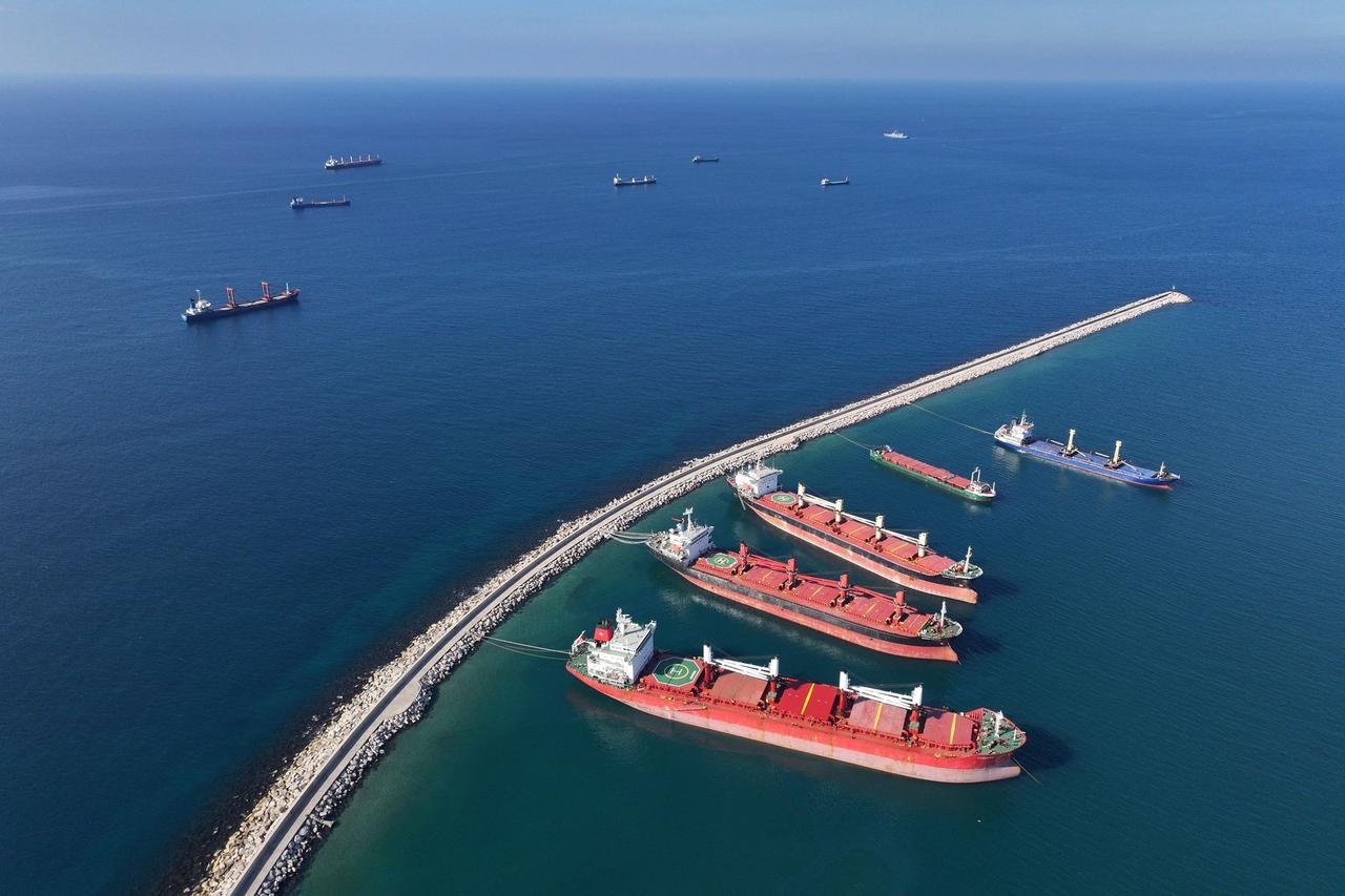 An aerial view shows container ships anchored off the coast of the western Syrian port city of Tartus, on December 18, 2024. (AFP Photo)