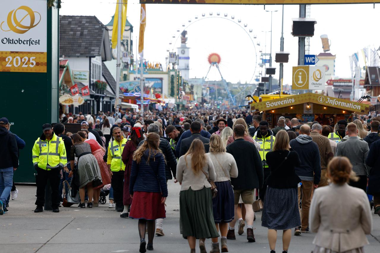 Visitors walk the ground of the Oktoberfest beer festival one day after the festival was closed over a bomb threat in Munich, southern Germany, on Oct. 2, 2025. (AFP Photo)