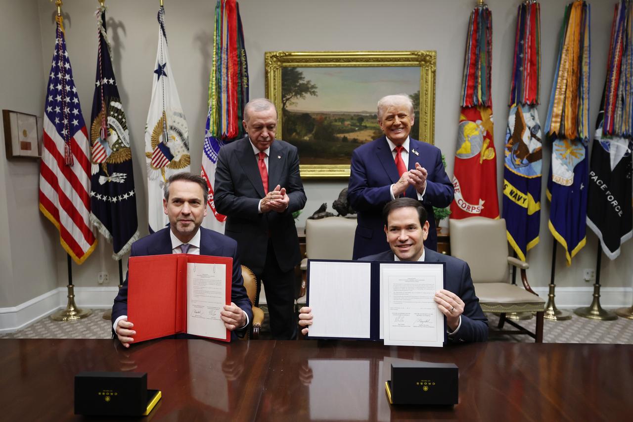Turkish Energy and Natural Resources Minister Alparslan Bayraktar signs an agreement on behalf of Turkiye following the meeting between Turkish President Recep Tayyip Erdogan and US President Donald Trump at White House in Washington, U.S. on Sept. 25, 2025. (Turkish Presidency / AA Photo)