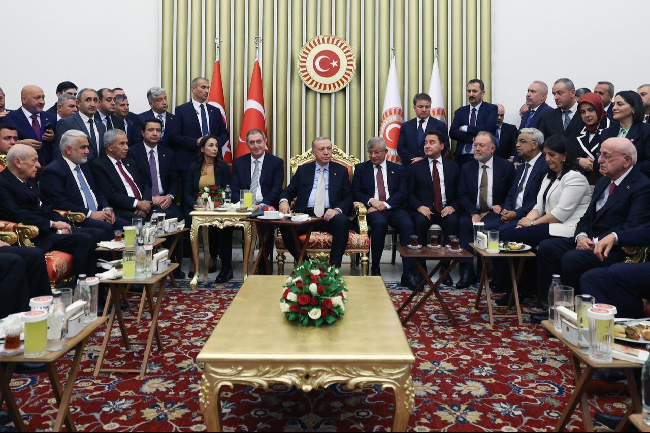 In the photo, President Erdogan is seen surrounded by leaders of all opposition parties except the CHP, alongside the ruling coalition partners, during the parliament reception on 1 October, 2025. (AA Photo)