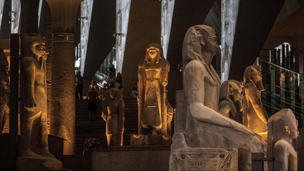Visitors walk past ancient Egyptian colossal statues along the Grand Staircase at the Grand Egyptian Museum in Giza on October 15, 2024. (AFP Photo )