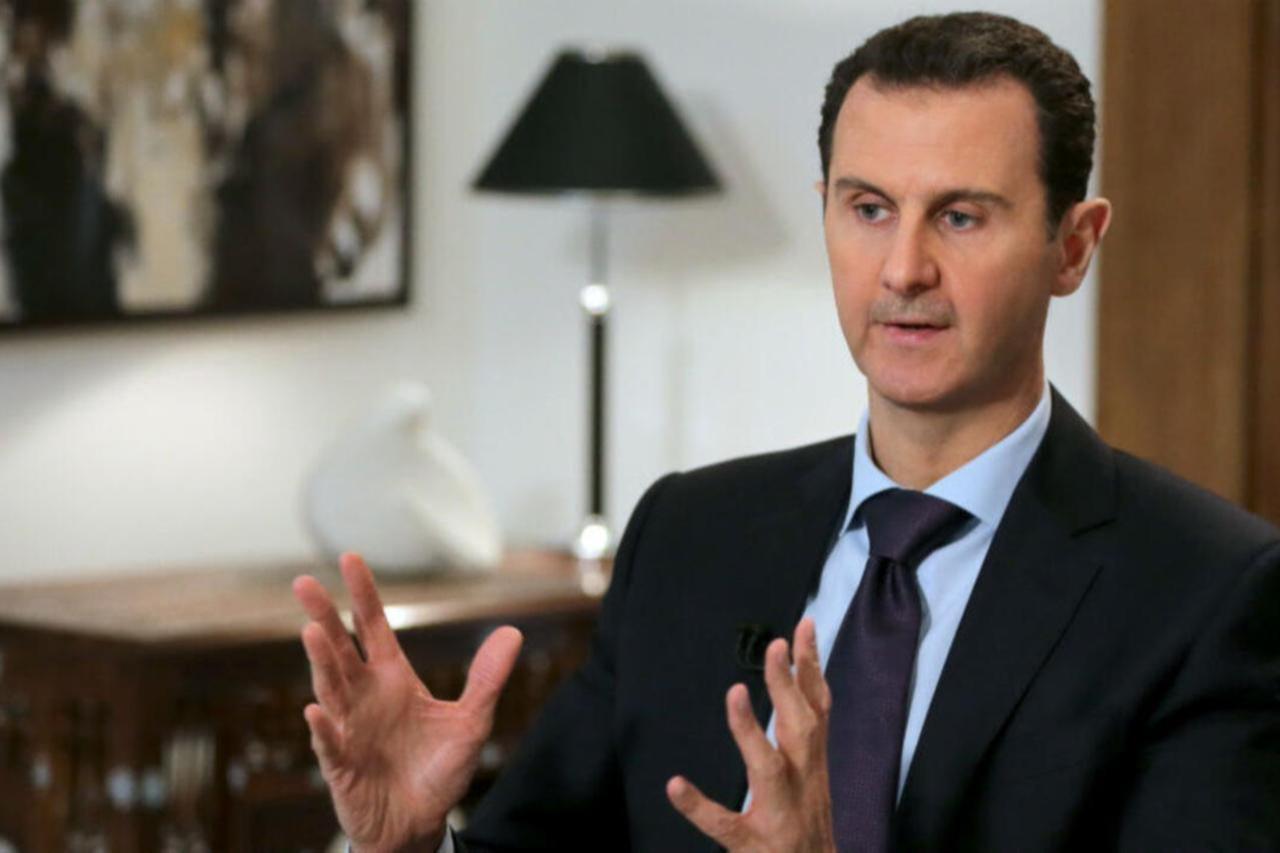 Ousted Syrian President Bashar al-Assad gestures during an exclusive interview with AFP in the capital Damascus , Feb. 11, 2016. (AFP Photo)