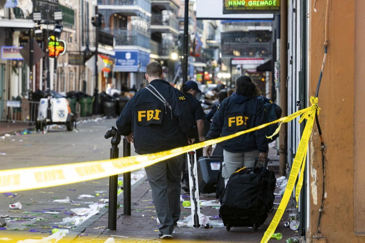 FBI investigators arrive at the scene where the white Ford F-150 pickup truck that crashed into a work lift after allegedly driving into a crowd of New Years revelers in the French Quarter of New Orleans, Louisiana, U.S., Jan. 1, 2025. (AFP Photo)