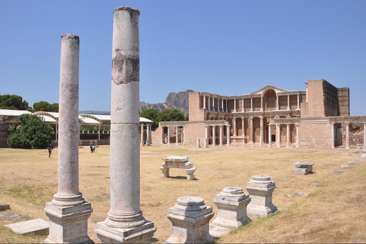Visitors walk among the ancient ruins of Sardis, once the capital of the Lydian Kingdom, in Manisa, Türkiye, July 13, 2025. (AA Photo)