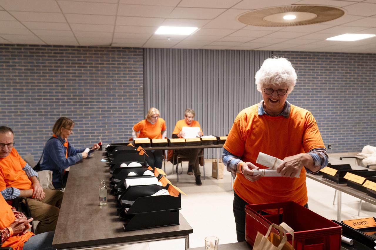 Tellers and polling station staff at the World Forum count ballots sent in by postal vote by voters abroad, the day after the Dutch parliamentary election vote, in The Hague, Netherlands, October 30, 2025. (AFP Photo)