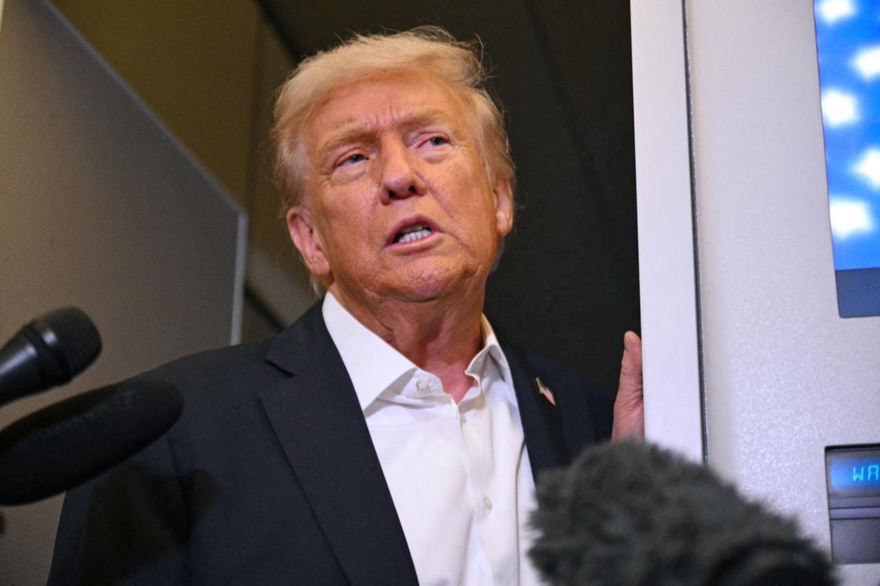 US President Donald Trump speaks with the press on board Air Force One in Mildenhall, Suffolk, on Oct. 14, 2025. (AFP Photo)