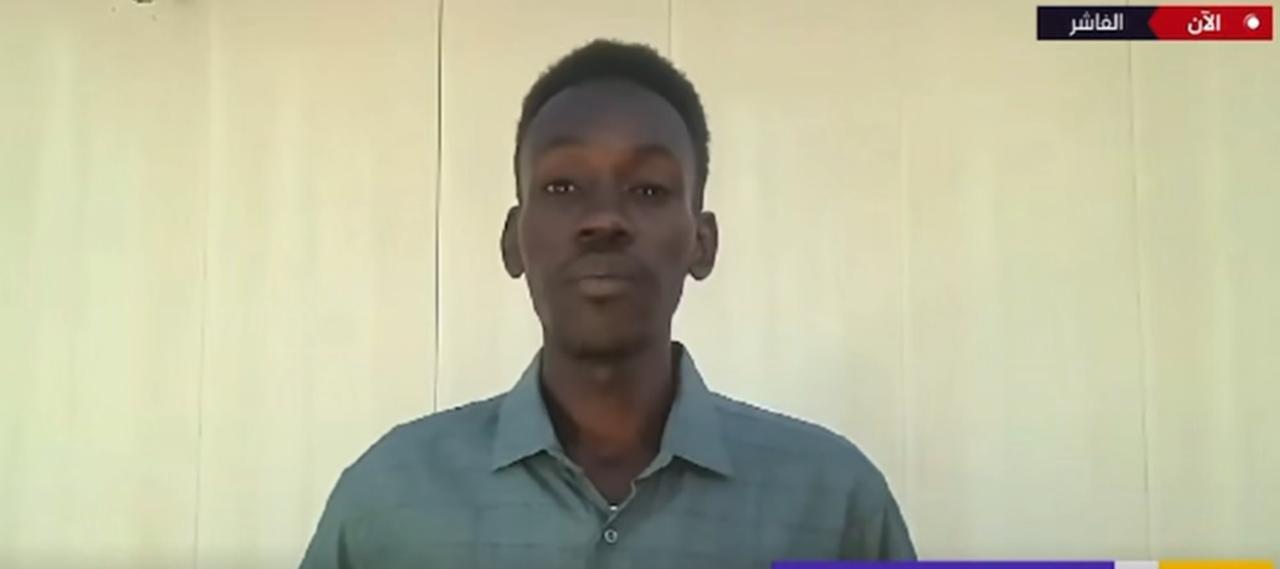 Sudanese journalist Muammar Ibrahim, who was detained by Rapid Support Forces after they stormed El-Fasher, during an interview with Al Jazeera. (Photo via Al Jazeera)