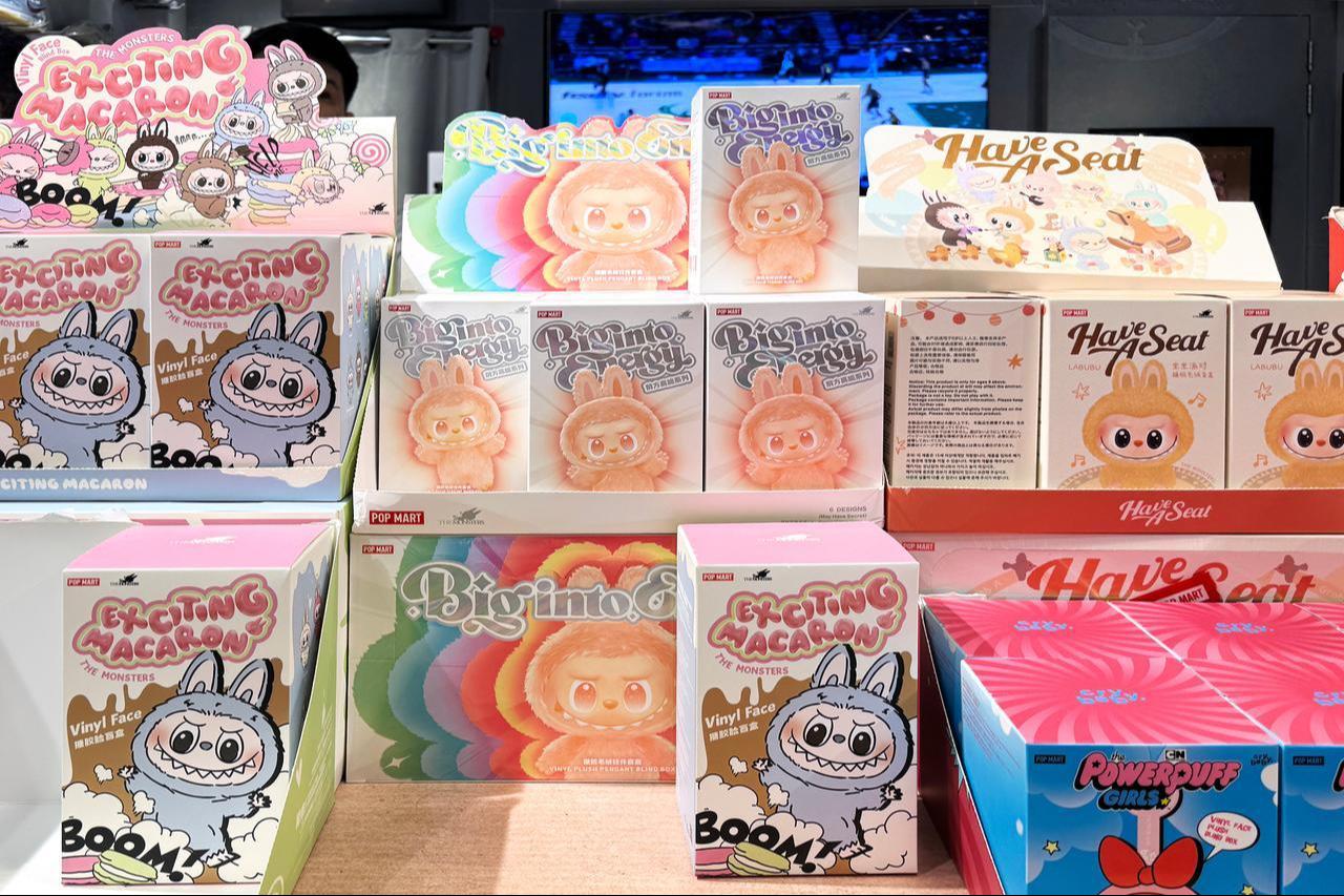 Pop Mart blind box toys including Labubu, Exciting Macaron, Biginto Pretty, and Crybaby Powerpuff Girls on display in a trendy toy store, Dubai, UAE, May 18, 2025. (Adobe Stock Photo)