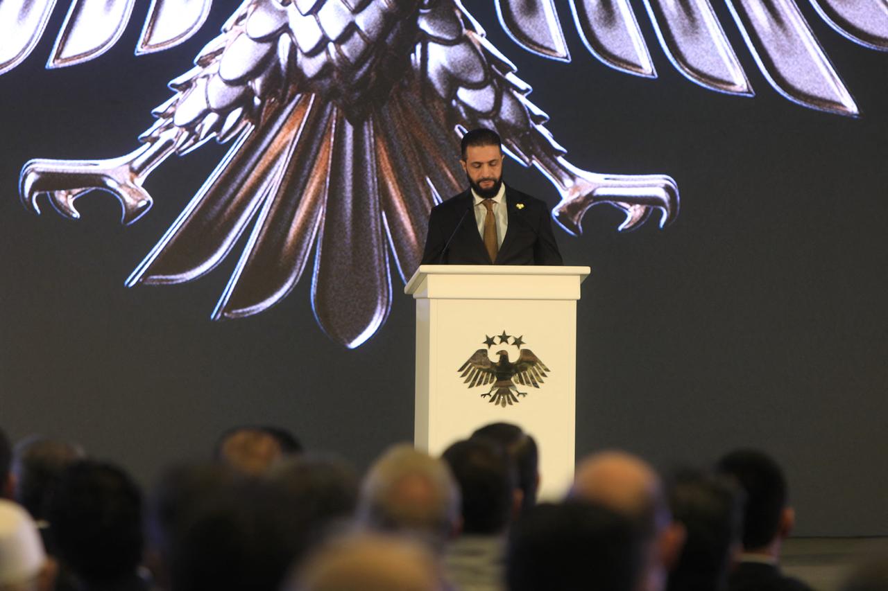 Syria's interim President Ahmad Al-Sharaa delivers a speech during the unveiling of the "New Visual Identity of the Syrian Arab Republic" at the presidential palace in Damascus on July 3, 2025. (AFP Photo )