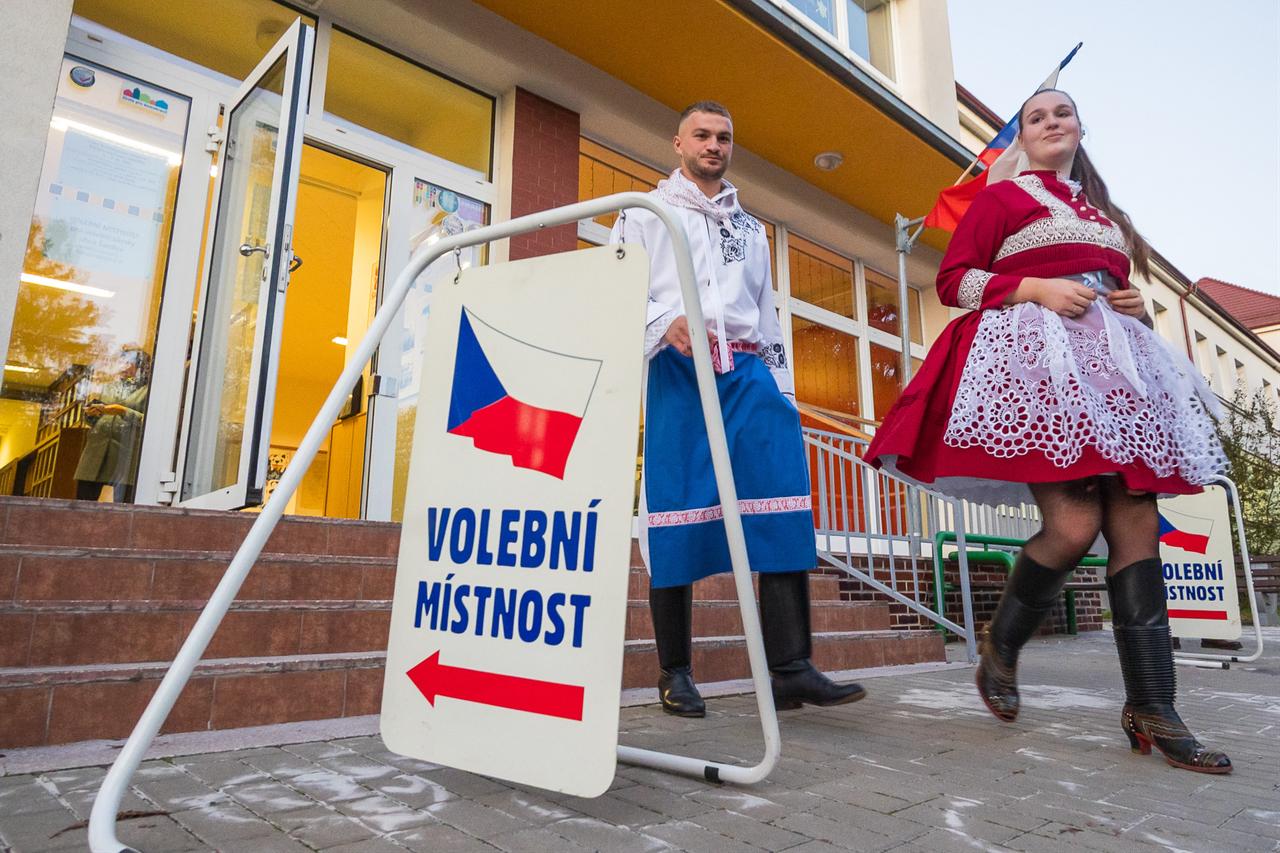 People dressed in traditional folk costumes leave a polling station after casting their vote in Sardice, South Moravia, Czech Republic, on Oct. 3, 2025. (AFP Photo)