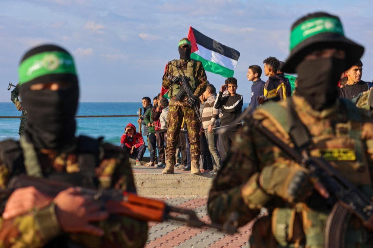 Palestinian group Hamas members secure an area before handing over an Israeli-American hostage to a Red Cross team in Gaza City on Feb. 1, 2025. (AFP Photo)