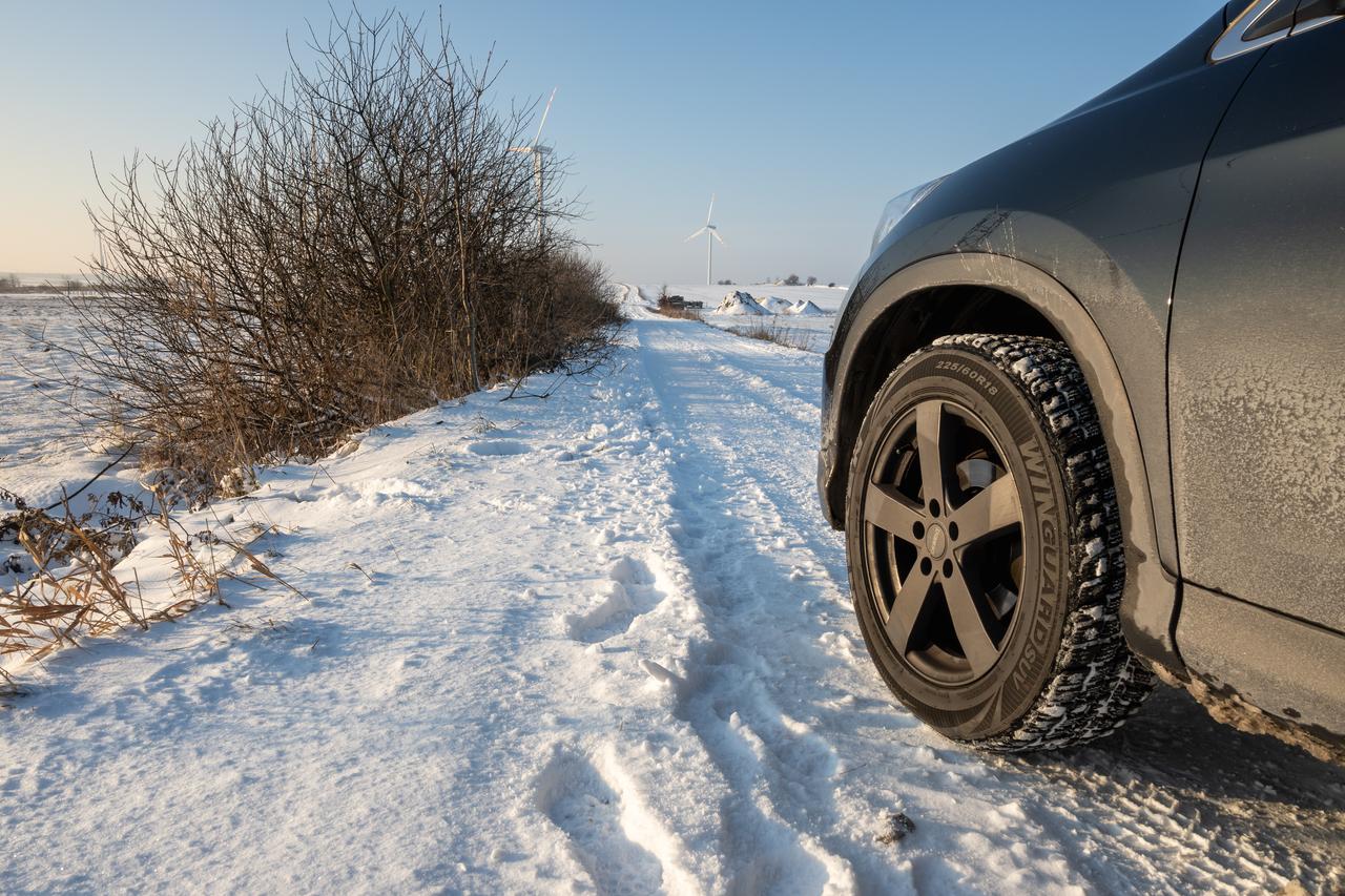 A car wheel on a snowy road in Puck, Poland, with winter tires on January 17, 2021. (Adobe Stock Photo)