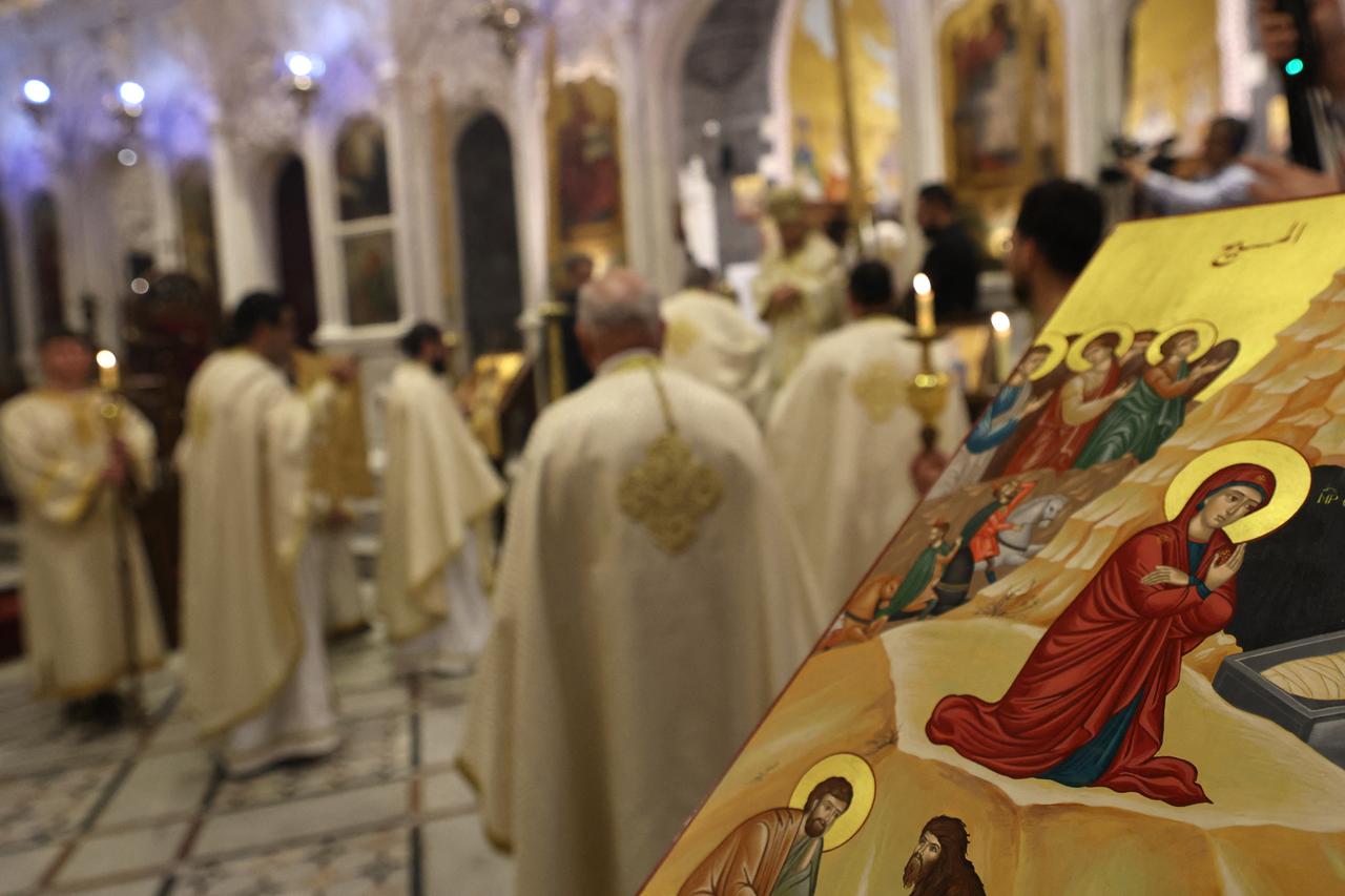 Christian worshippers attend Christmas Eve Mass at the Cathedral of Our Lady of the Dormition, known also as the Olive Church, in Damascus, December 24, 2024. (AFP Photo)