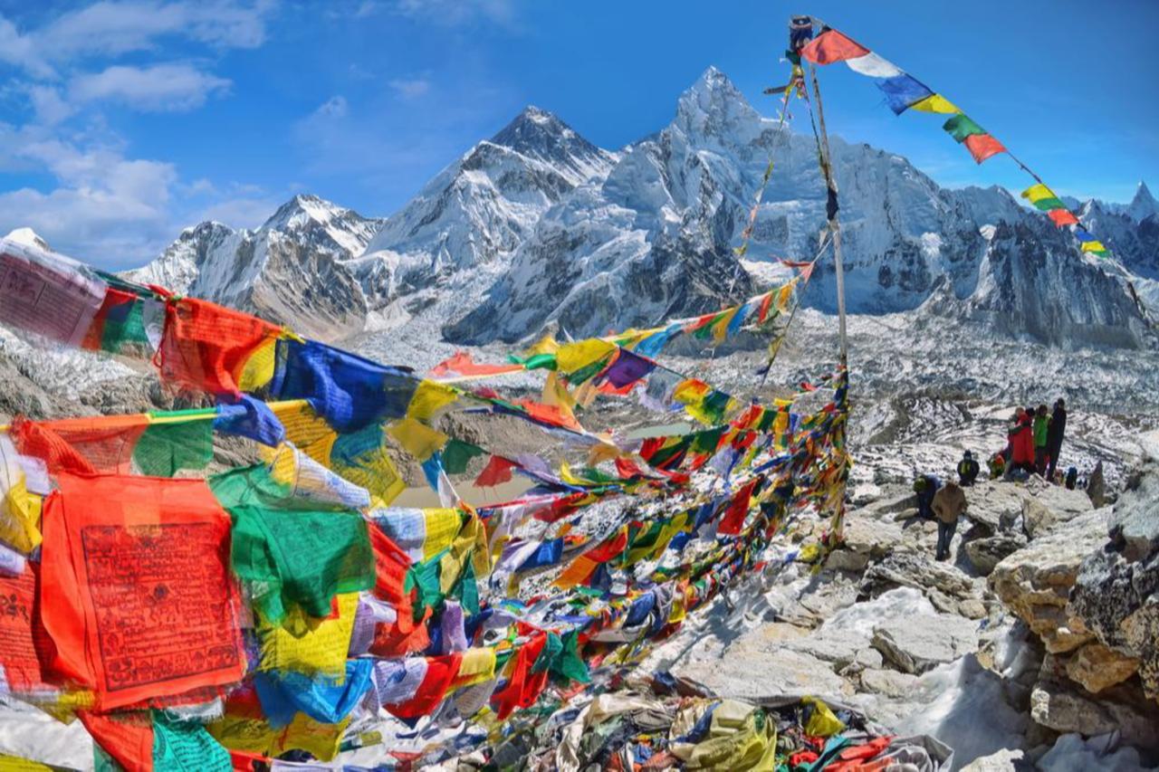 A view of Mount Everest and Nuptse with buddhist prayer flags from kala patthar in Sagarmatha National Park in Nepal Himalayai, accessed on Oct. 5, 2025. (Adobe Stock Photo)