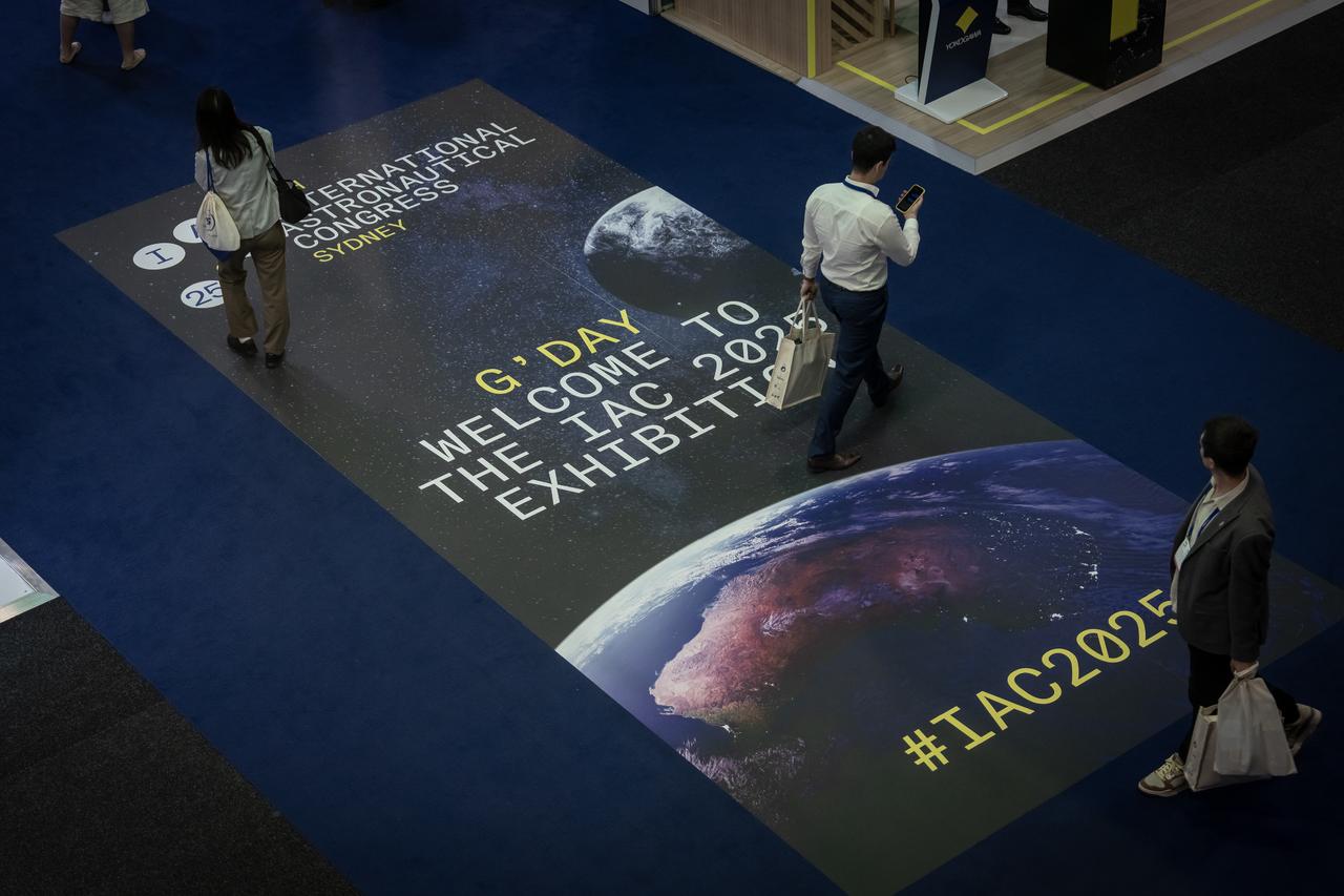 People explore exhibitions in the foyer area and take part in space-themed interactive experiences during 76th International Astronautical Congress in Sydney, Australia, Oct. 2, 2025. (AA Photo)