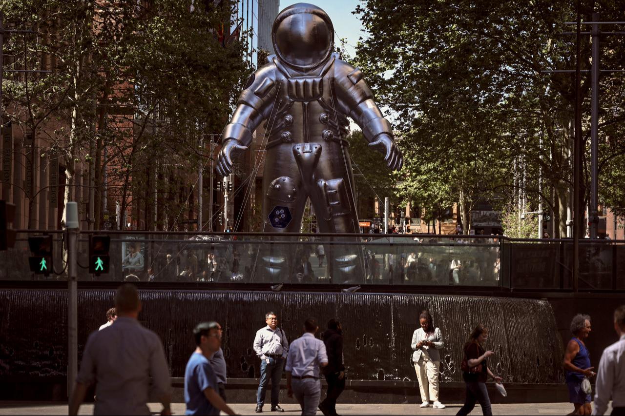 Pedestrians walk past an inflatable astronaut in Sydney’s Martin Place on October 3, 2025 that is part of a promotion for the 76th International Astronautical Congress. (AFP Photo)