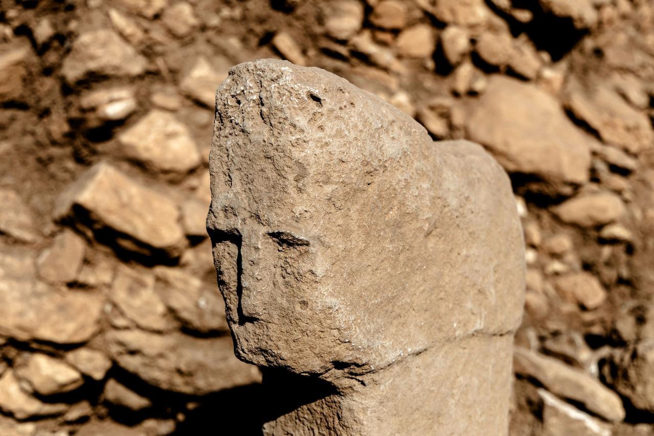 A close-up view of the 12,000-year-old T-shaped pillar featuring a human face discovered at Karahantepe in southeastern Türkiye, Oct. 6, 2025. (Photo via Ministry of Culture and Tourism)