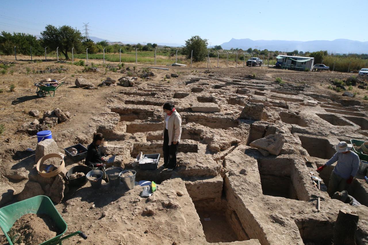 Archaeologists work among dozens of aligned tombs forming one of the largest rock-cut burial fields in Anatolia, at the ancient city of Colossae in Denizli, Türkiye, Oct. 6, 2025. (AA Photo)