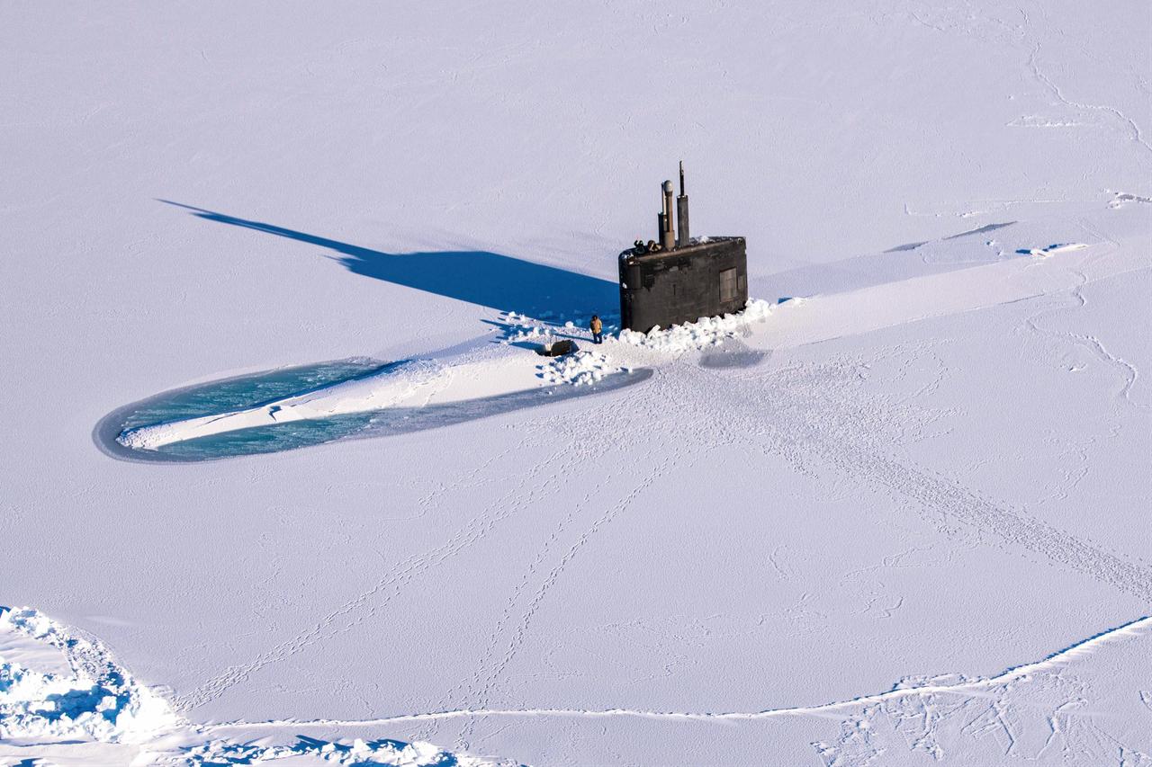The Los Angeles-class fast-attack submarine USS Pasadena (SSN 752) breaks through the ice in ICEX, which happened concurrently with Arctic Edge 2022, March 12, 2022. (Photo via U.S. Navy)