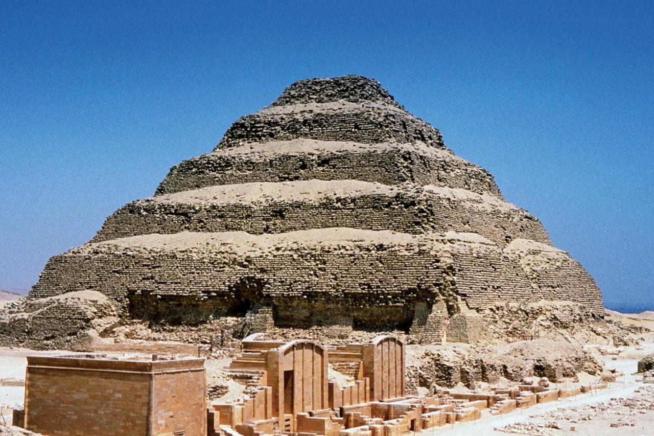 The Step Pyramid of Djoser, attributed to the architect Imhotep, who designed the pyramid as the tomb for the first king of the 3rd dynasty, at Saqqara, Egypt, c. 26th century B.C. (Photo via Britannica)