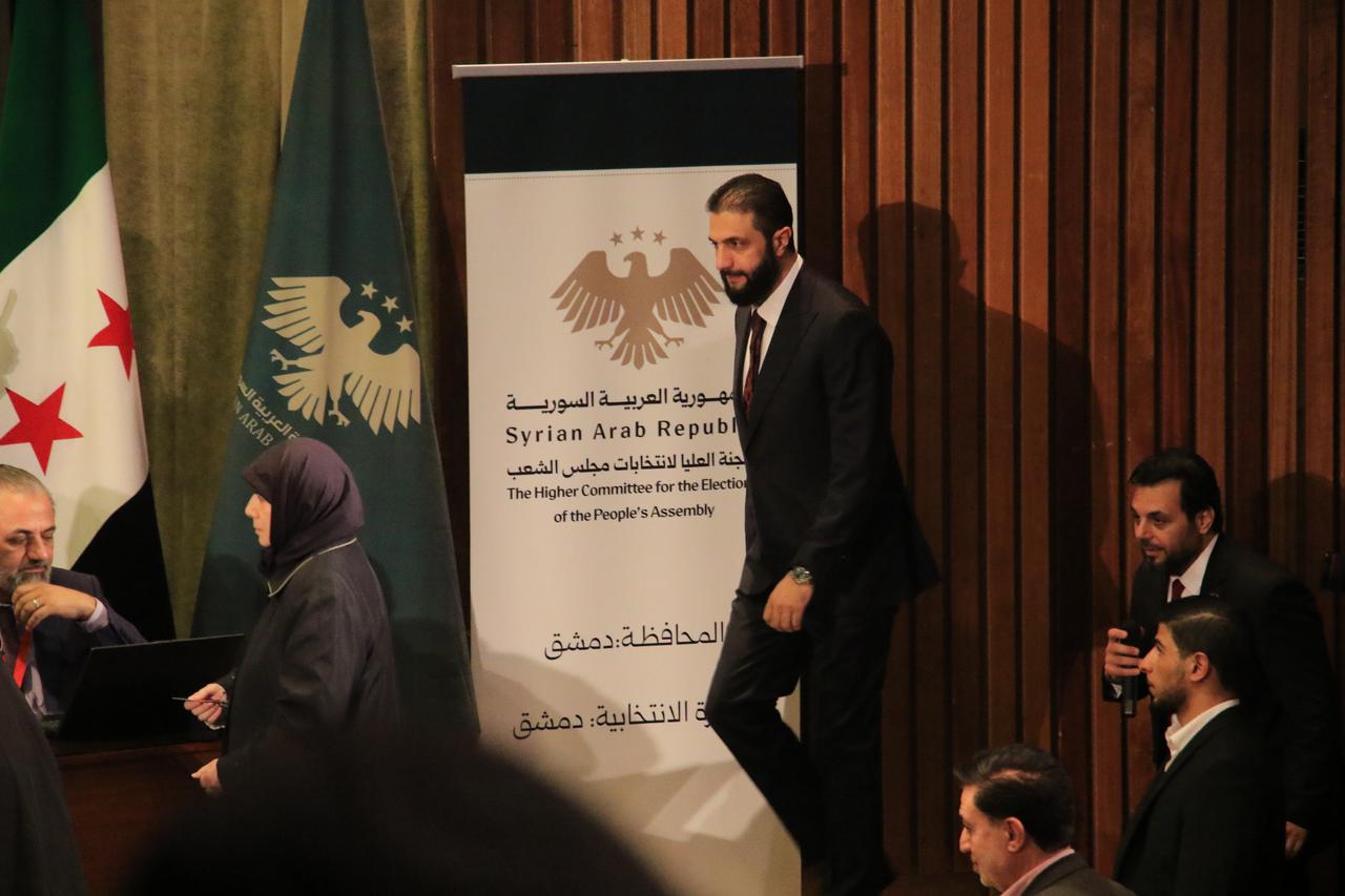 Syrian President Ahmad Al-Sharaa arrives at the National Library polling center to observe the electoral process, in Damascus, Syria on Oct. 5, 2025. (AA Photo)