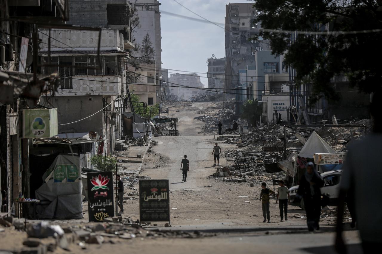 Palestinians walk through streets lined with destroyed buildings as Israel’s attacks on Gaza continue for nearly two years, in Gaza City, Gaza on October 5, 2025. (AA Photo)