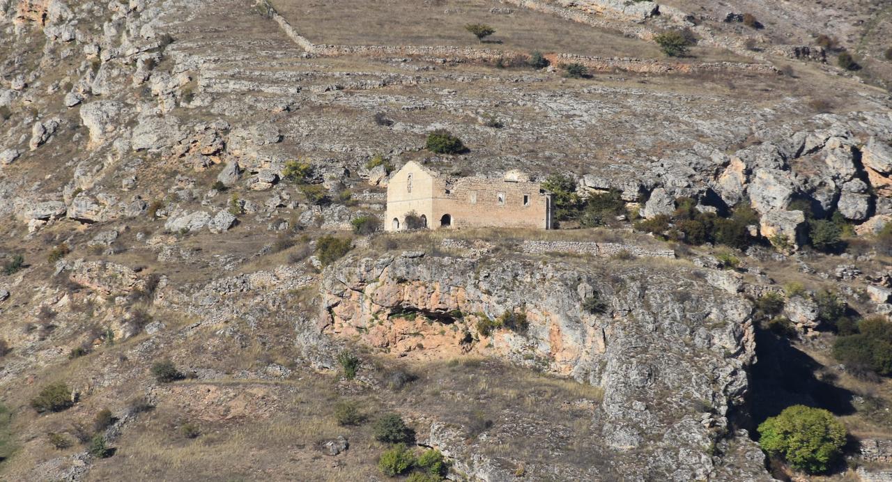 An aerial view of a church built on rocky terrain in Krom Valley, included in the study on earthquake resilience of historic structures in Gumushane, Türkiye, Oct. 5, 2025. (AA Photo)
