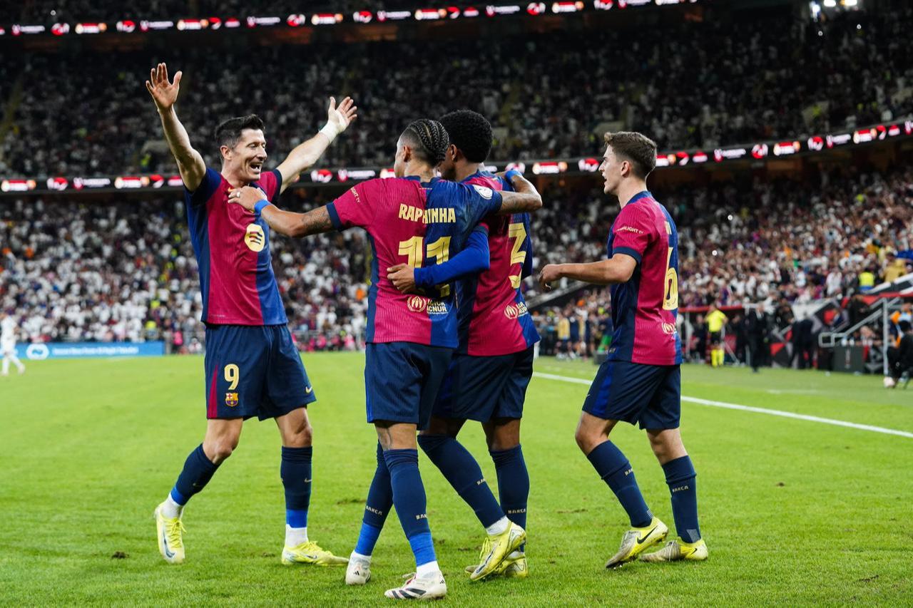 Alejandro Balde (2nd R) of Barcelona celebrates with his teammates after scoring a goal during the Spanish Super Cup final, known as 'El Clasico,' between Real Madrid and Barcelona at the King Abdullah Sports City Stadium in Jeddah, Saudi Arabia, Jan. 12, 2025. (AA Photo)