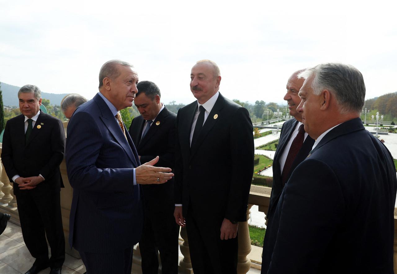 President Erdogan (3L) speaking with Azerbaijan's President Aliyev (C), Turkish Cyprus President Tatar (2R) during 12th Summit of the Organization of Turkic State in Gabala, in Azerbaijan. (Photo Handout/Turkish Presidency Press Office/AFP)