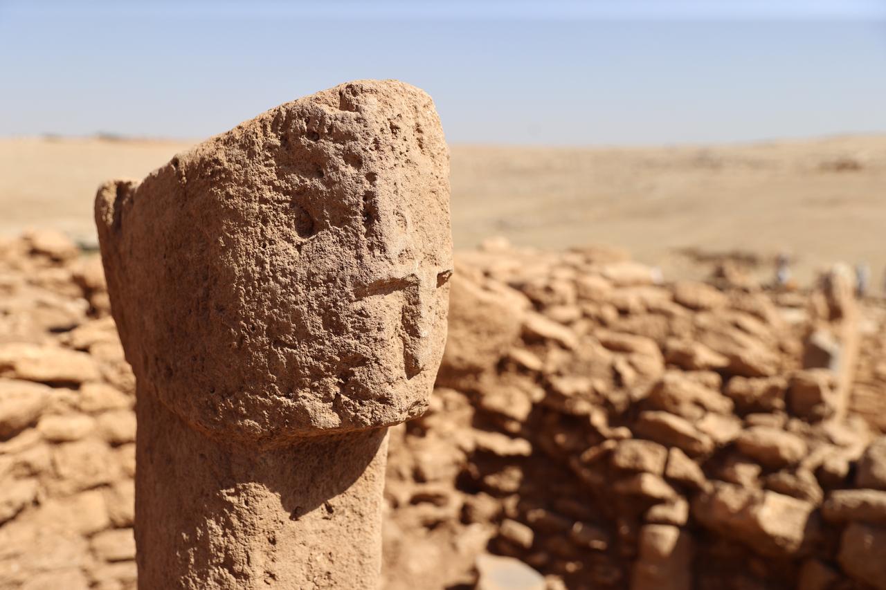 A close-up view of the 12,000-year-old T-shaped pillar featuring a human face discovered at Karahantepe in Sanliurfa, southeastern Türkiye, Oct. 6, 2025. (AA Photo)