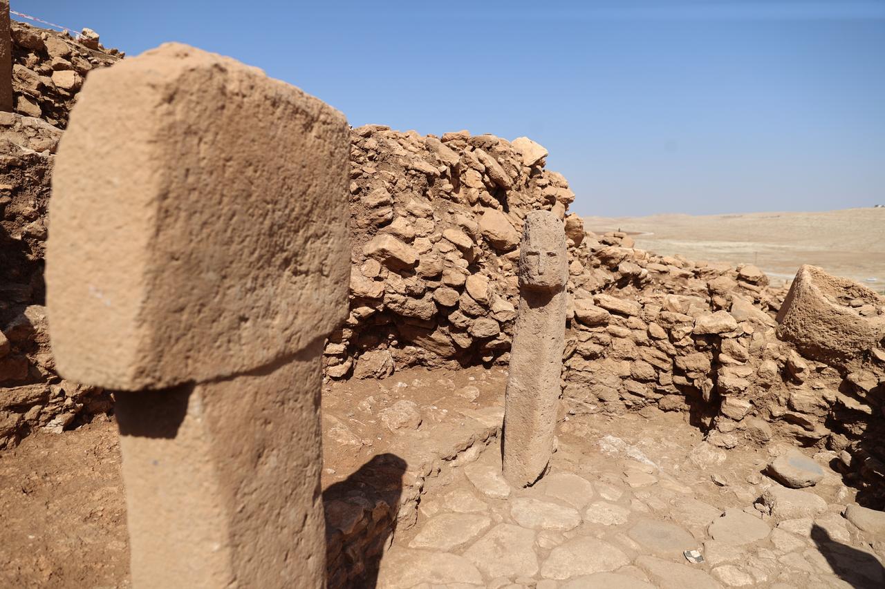 A view of the 12,000-year-old T-shaped pillar featuring a human face discovered at Karahantepe in Sanliurfa, southeastern Türkiye, Oct. 6, 2025. (Photo via Ministry of Culture and Tourism)