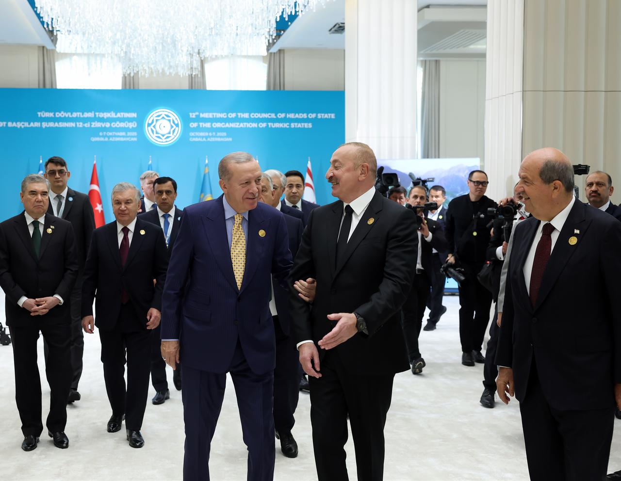 President Erdogan (front L) is welcomed by the Azerbaijani President Aliyev (C) at 12th Summit of the Council of Heads of State of the Organization of Turkic States in Gabala, Azerbaijan, Oct. 7, 2025. (Photo via Turkish Presidency/Mustafa Kamaci)