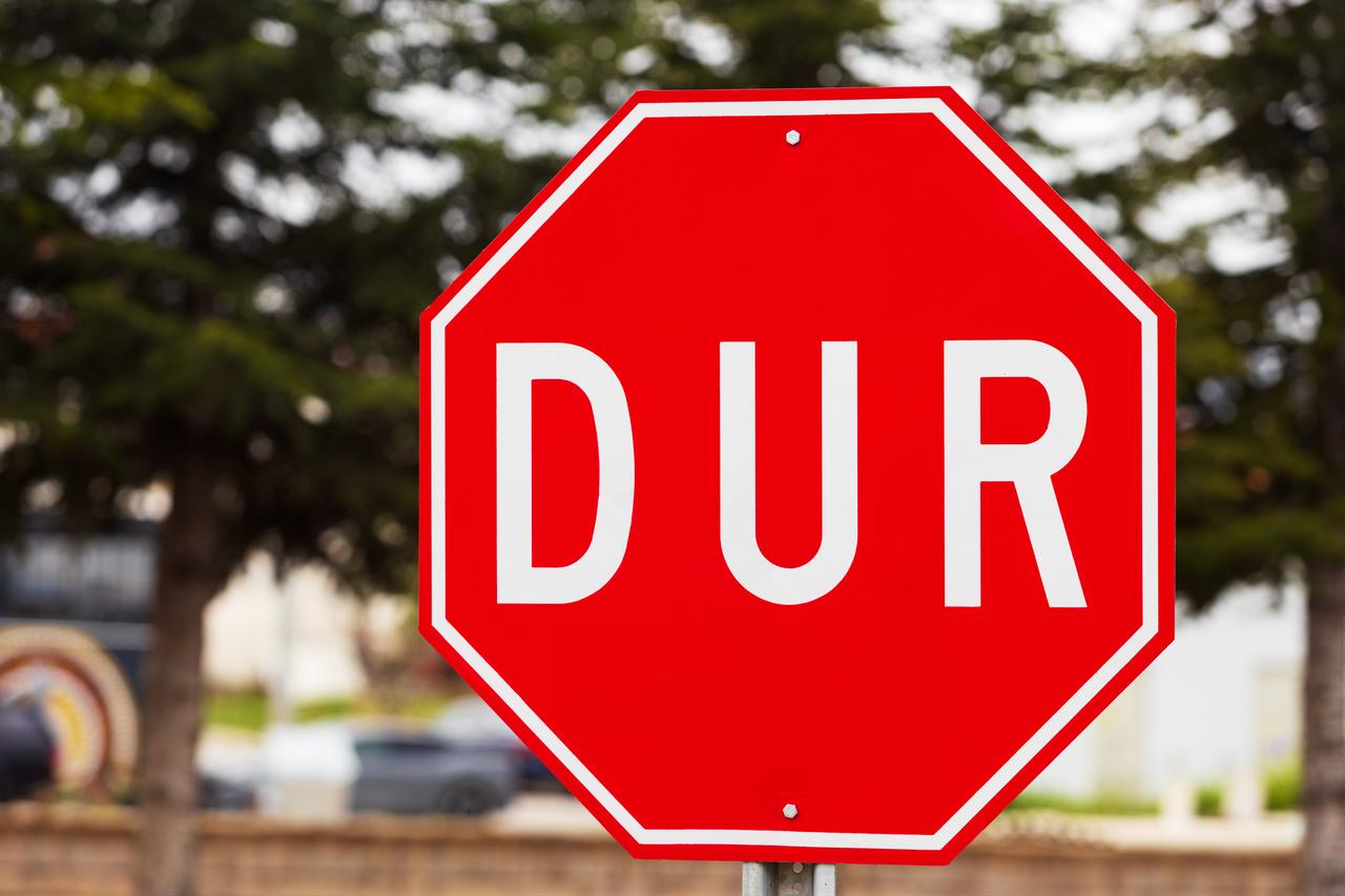 Close-up of a 'stop' sign on a road in Türkiye. (Adobe Stock Photo)