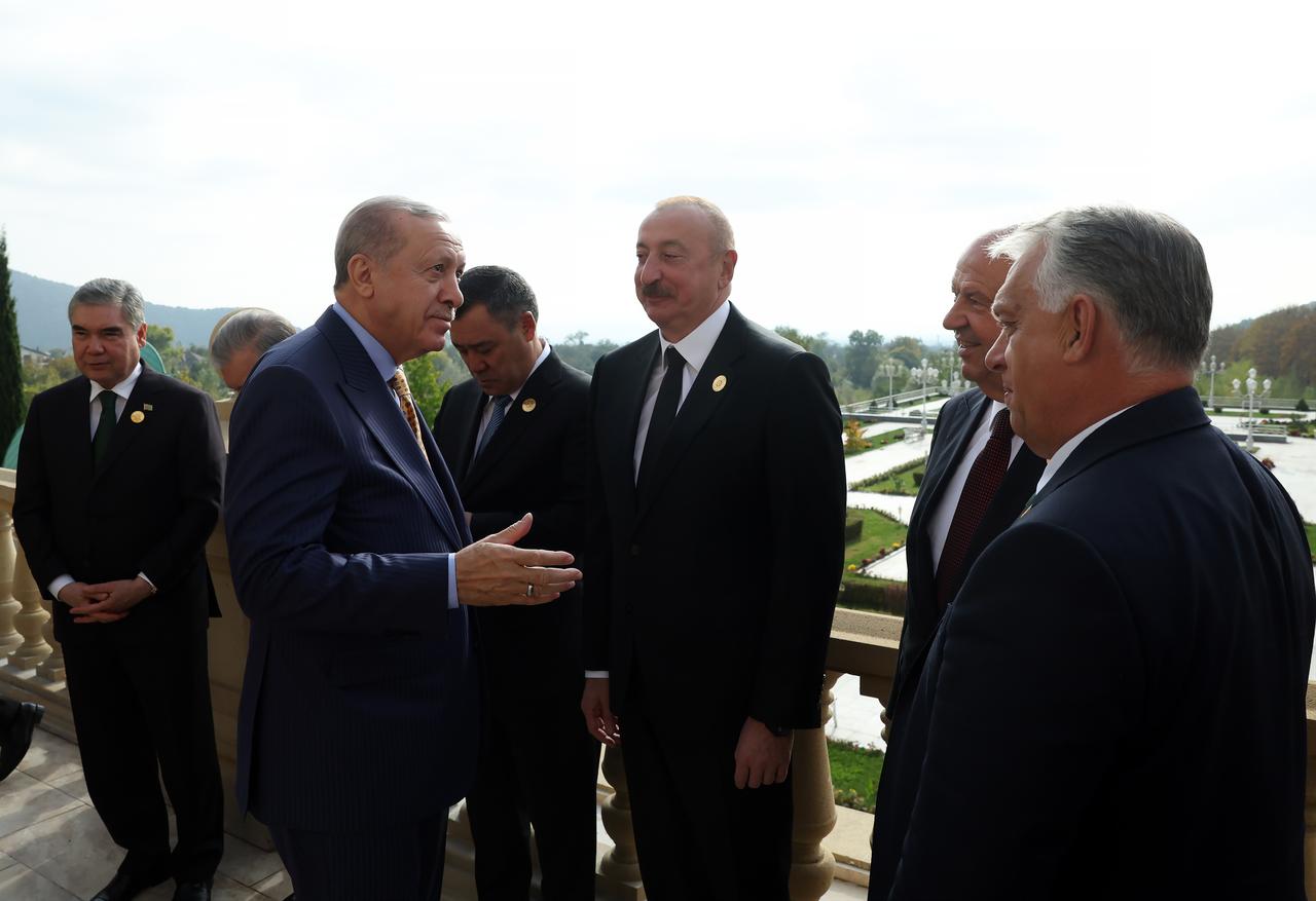 Turkish President Recep Tayyip Erdogan (C), chats with Turkish Republic of Northern Cyprus (TRNC) President Ersin Tatar (2nd R), Azerbaijani President Ilham Aliyev (C), and Hungarian Prime Minister Viktor Orban (R) during the 12th Meeting of the Council of Heads of State of the Organization of Turkic States at Heydar Aliyev Congress Center in Gabala, Azerbaijan on Oct. 7, 2025. (Turkish Presidency / AA Photo)