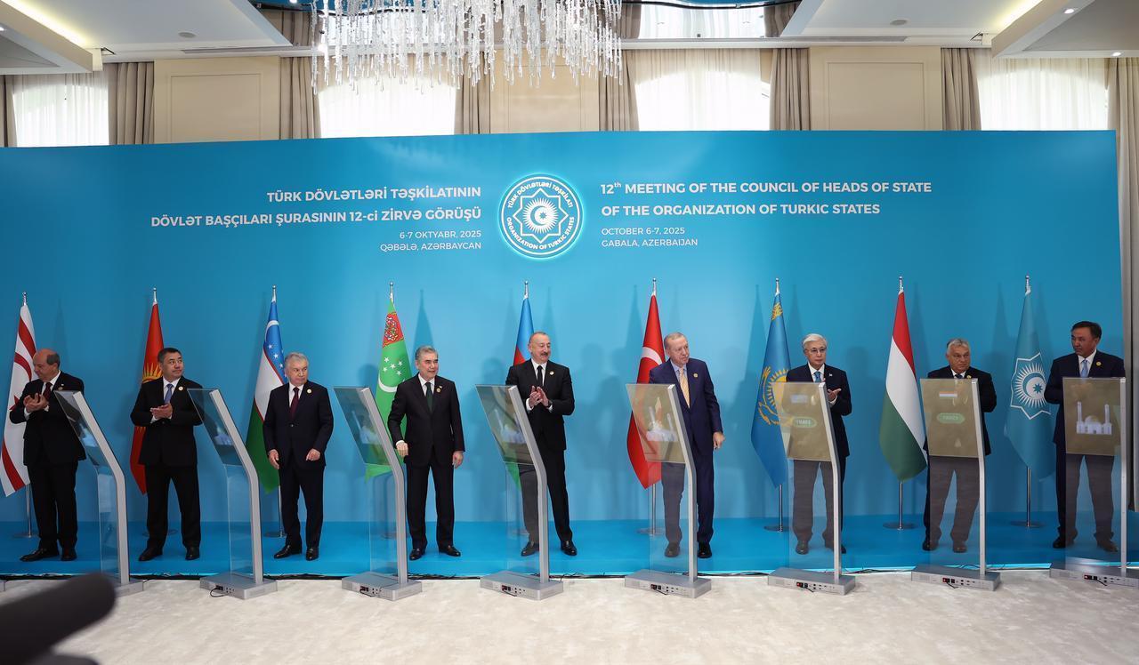 Turkish President Recep Tayyip Erdogan (4th R), Azerbaijani President Ilham Aliyev (C), Uzbek President Shavkat Mirziyoyev (3rd L), Kyrgyz President Sadyr Japarov (2nd L), Kazakh President Kassym-Jomart Tokayev (3rd R), Turkmen National Leader Gurbanguly Berdimuhamedov (4th L), Hungarian Prime Minister Viktor Orban (2nd R), Turkish Republic of Northern Cyprus (TRNC) President Ersin Tatar (L), and OTS Secretary General Ambassador Kubanychbek Omuraliyev (R) attend the 12th Meeting of the Council of Heads of State of the Organization of Turkic States at Heydar Aliyev Congress Center in Gabala, Azerbaijan on Oct. 7, 2025. (Turkish Presidency / AA Photo)
