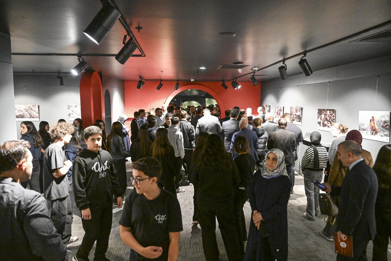 Visitors view photographs from Anadolu’s The Witness exhibition documenting Gaza war crimes, at the Umraniye Culture and Art Center in Istanbul, Türkiye, Oct. 7, 2025. (AA Photo)