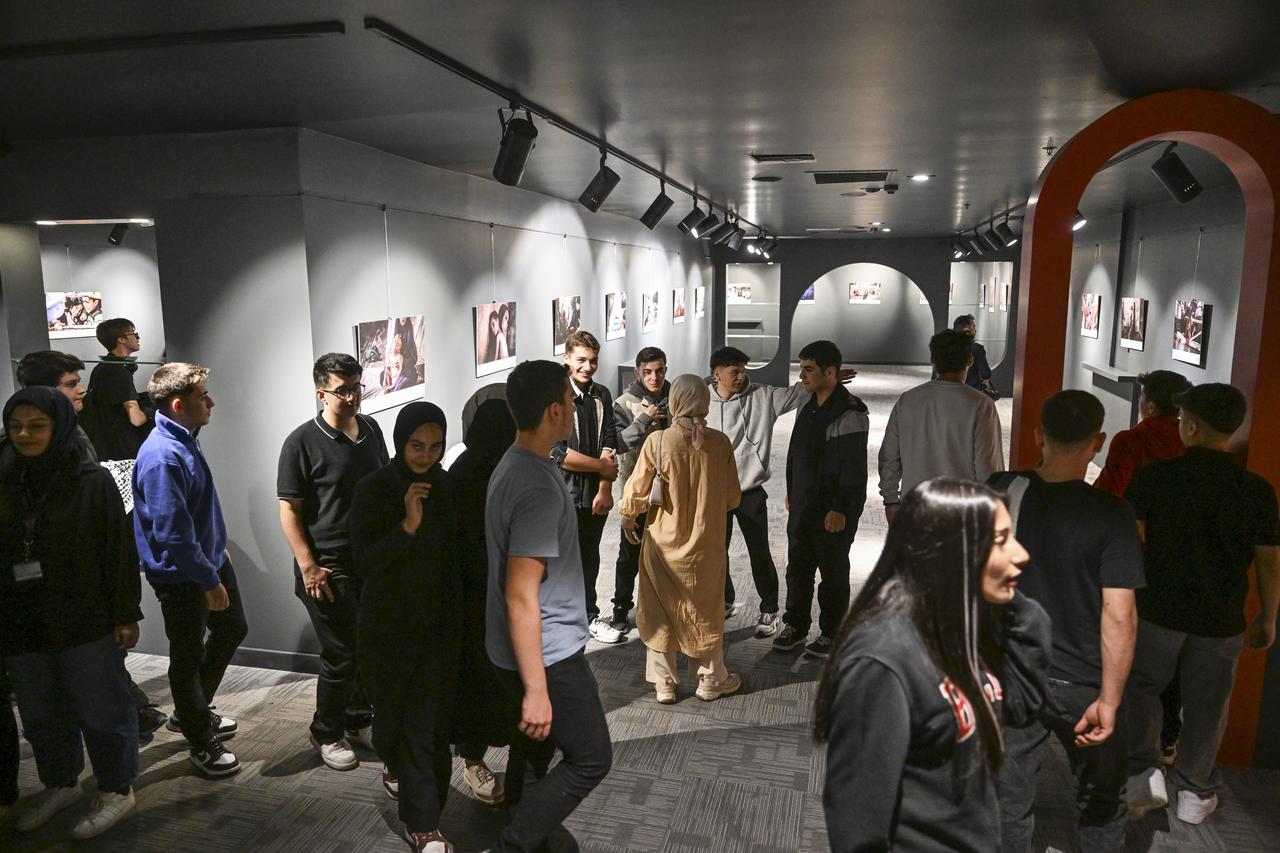 Students and visitors tour Anadolu’s The Witness exhibition portraying scenes from Gaza, at the Umraniye Culture and Art Center in Istanbul, Türkiye, Oct. 7, 2025. (AA Photo)