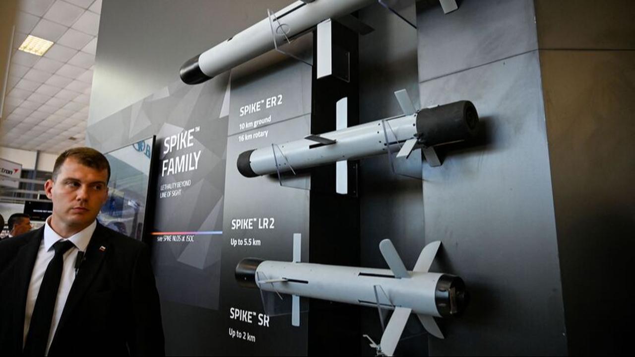 A person walks past Spike anti-tank missiles at Rafael stand during 15th Defence Equipment and services Exhibition in Plovdiv, Bulgaria, June 1, 2022. (AFP Photo)