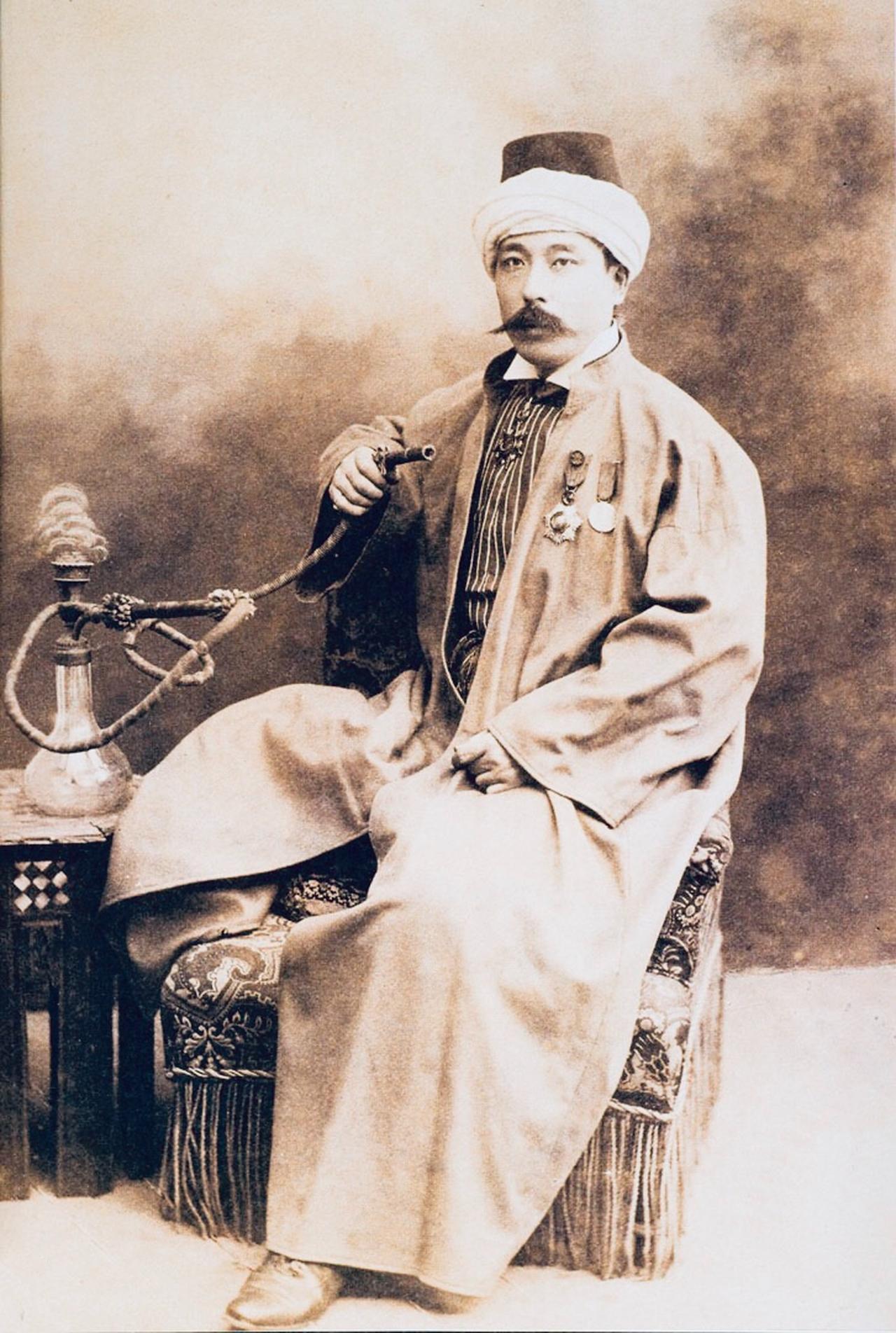 Yamada Torajiro wearing Ottoman attire and smoking a water pipe after receiving the Order of the Medjidie, early 1900s. (Photo via Yamada Family Archive)